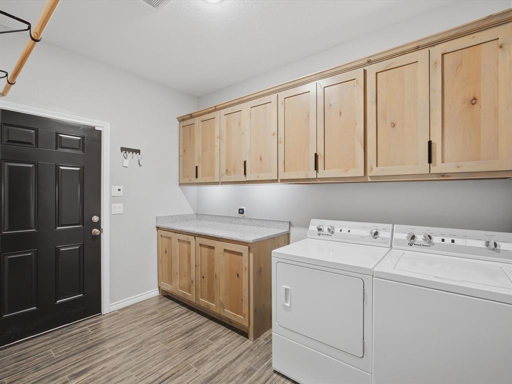 117 Ranchview Court Bowie, TX 76230 - Photo 24 of 40 a view of cabinets with wooden floor