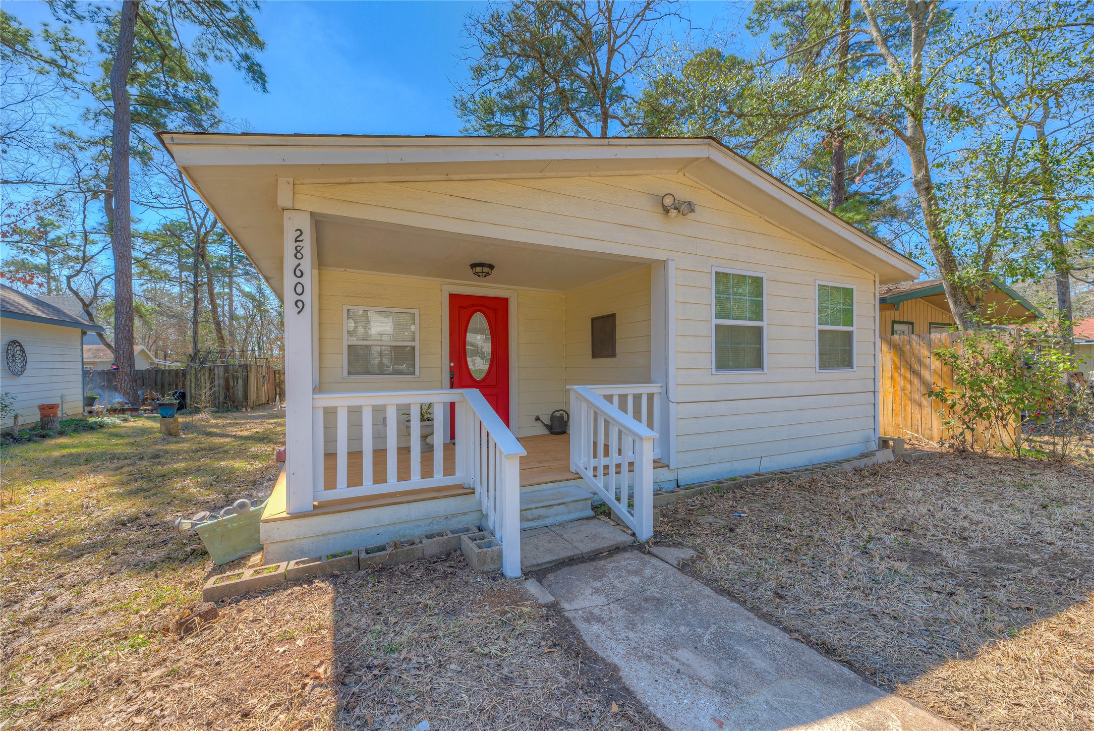 28609 Netawake Court Point Blank, TX 77364 - Photo 17 of 32 a view of a wooden house with a yard