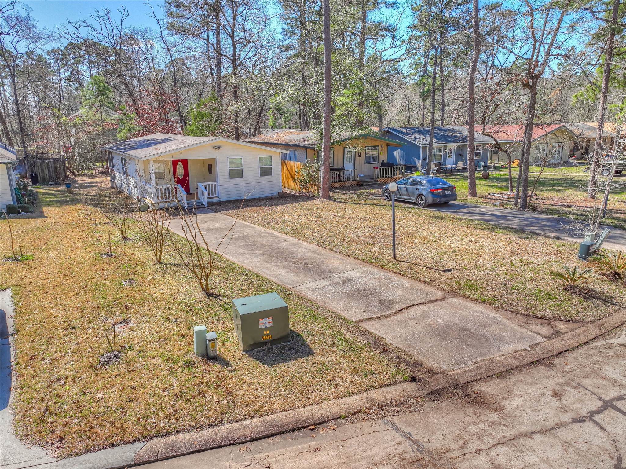 28609 Netawake Court Point Blank, TX 77364 - Photo 22 of 32 a view of a yard with cars