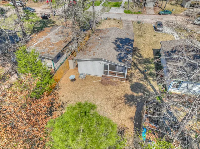 a aerial view of a house with a yard
