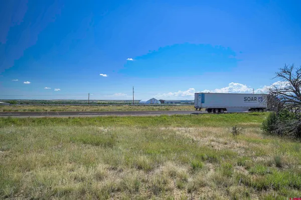 a view of a road with a yard