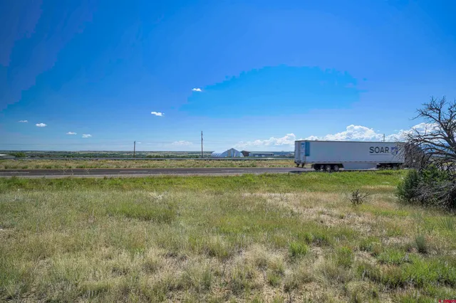 a view of a road with a yard