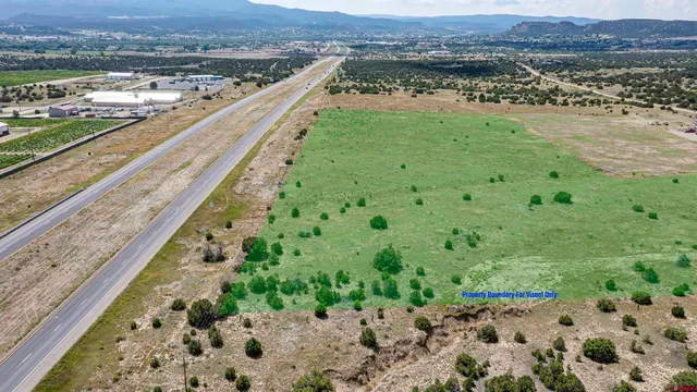 a view of a field with an ocean view