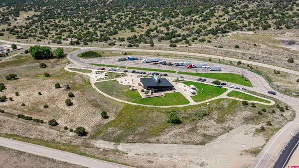 a view of water heater room with wooden floor