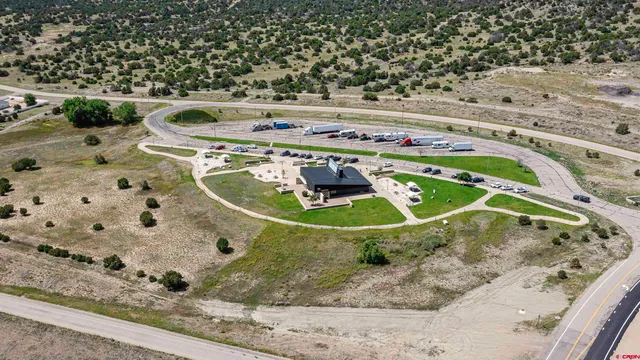 a view of water heater room with wooden floor