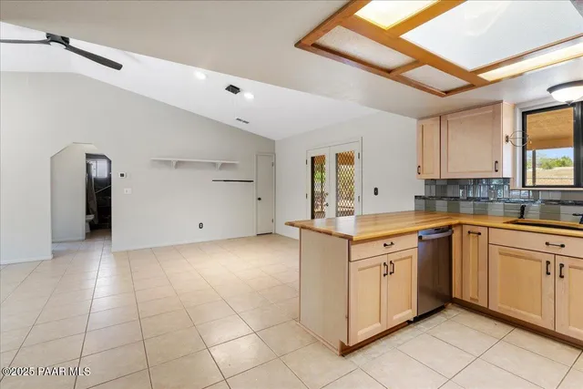 a kitchen with a sink cabinets and window
