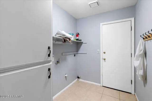 a room with a white cabinet and a shower