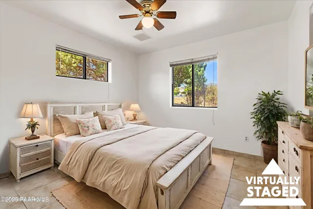 a bedroom with bed and a window