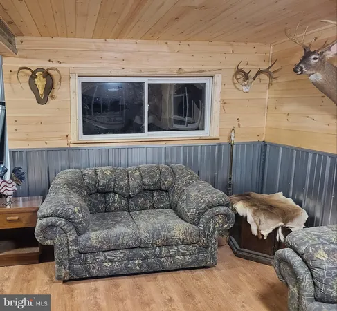 a view of a dinning table and chairs in the roof deck