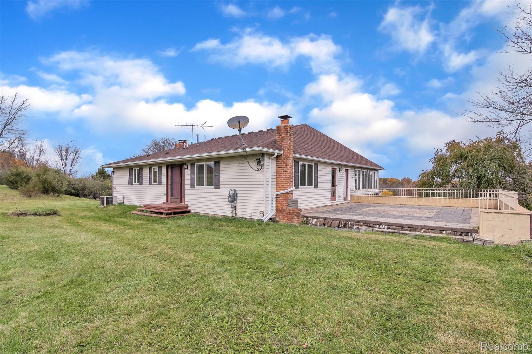 4211 Crandall Road Howell, MI 48855 - Photo 31 of 42 Rear / Upstairs Entry and Paver Patio