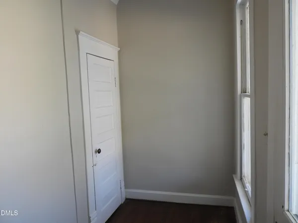 a view of a backyard with a tree