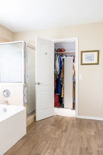 a view of a livingroom with a furniture and closet