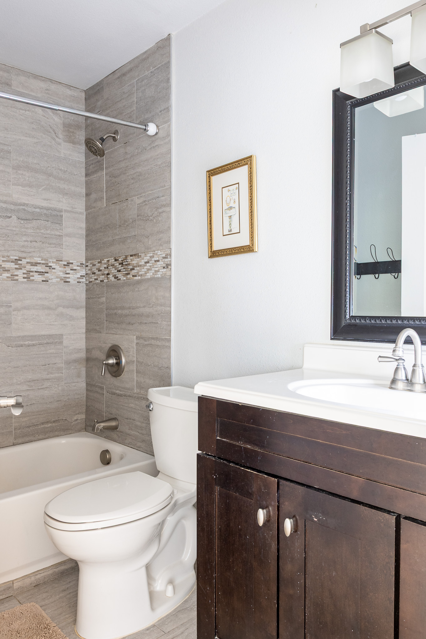 3704 Caney Creek Road Austin, TX 78732 - Photo 23 of 38 a bathroom with a sink a toilet and shower