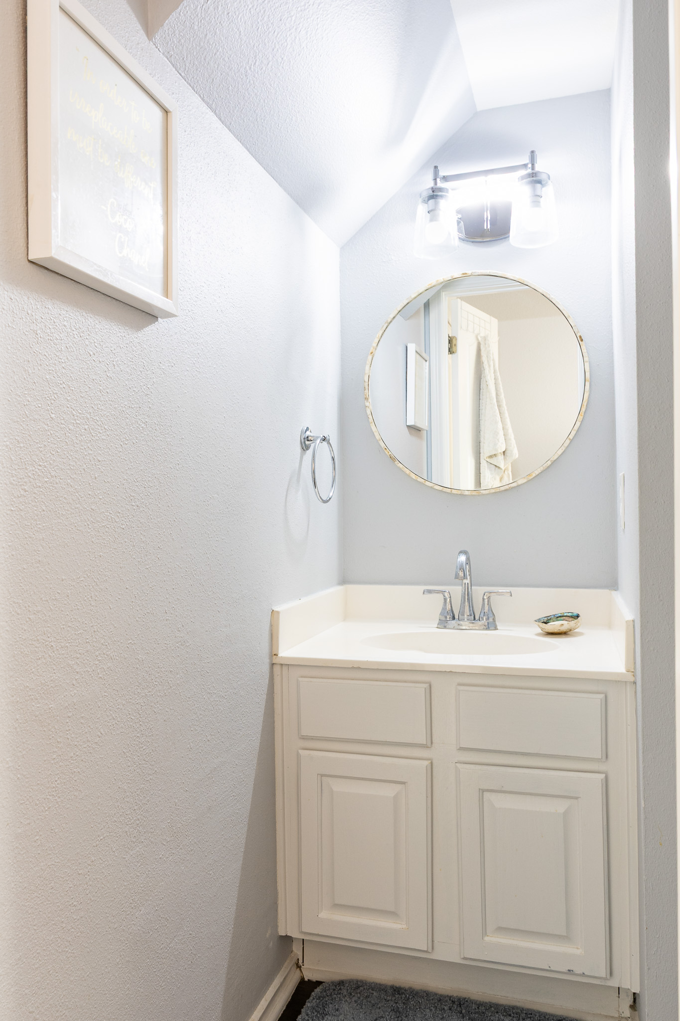 3704 Caney Creek Road Austin, TX 78732 - Photo 27 of 38 a bathroom with a sink and a mirror