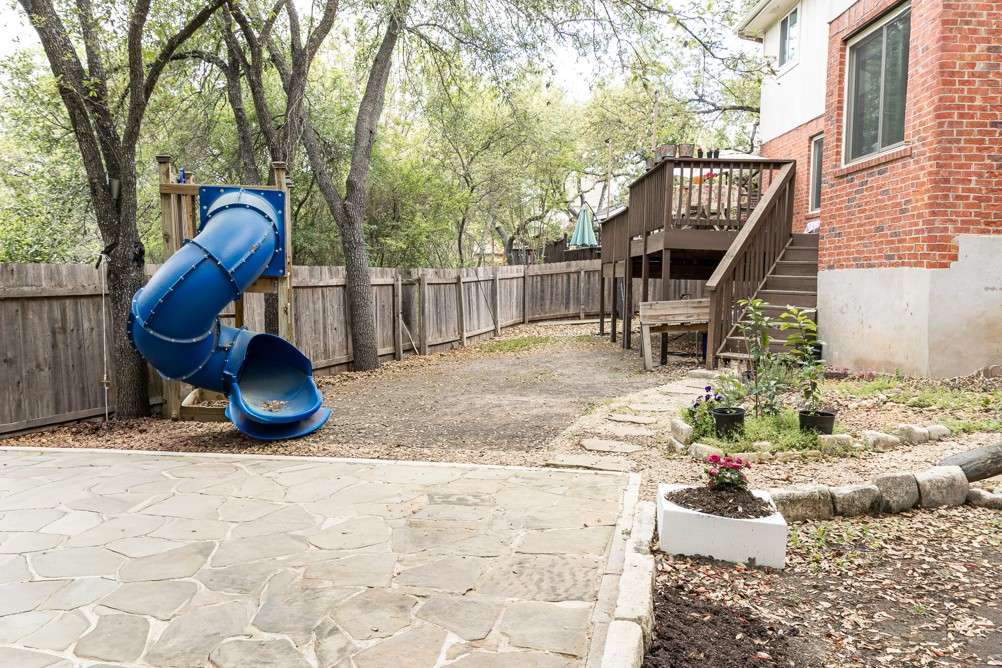 3704 Caney Creek Road Austin, TX 78732 - Photo 31 of 38 a view of a backyard with sitting area and furniture