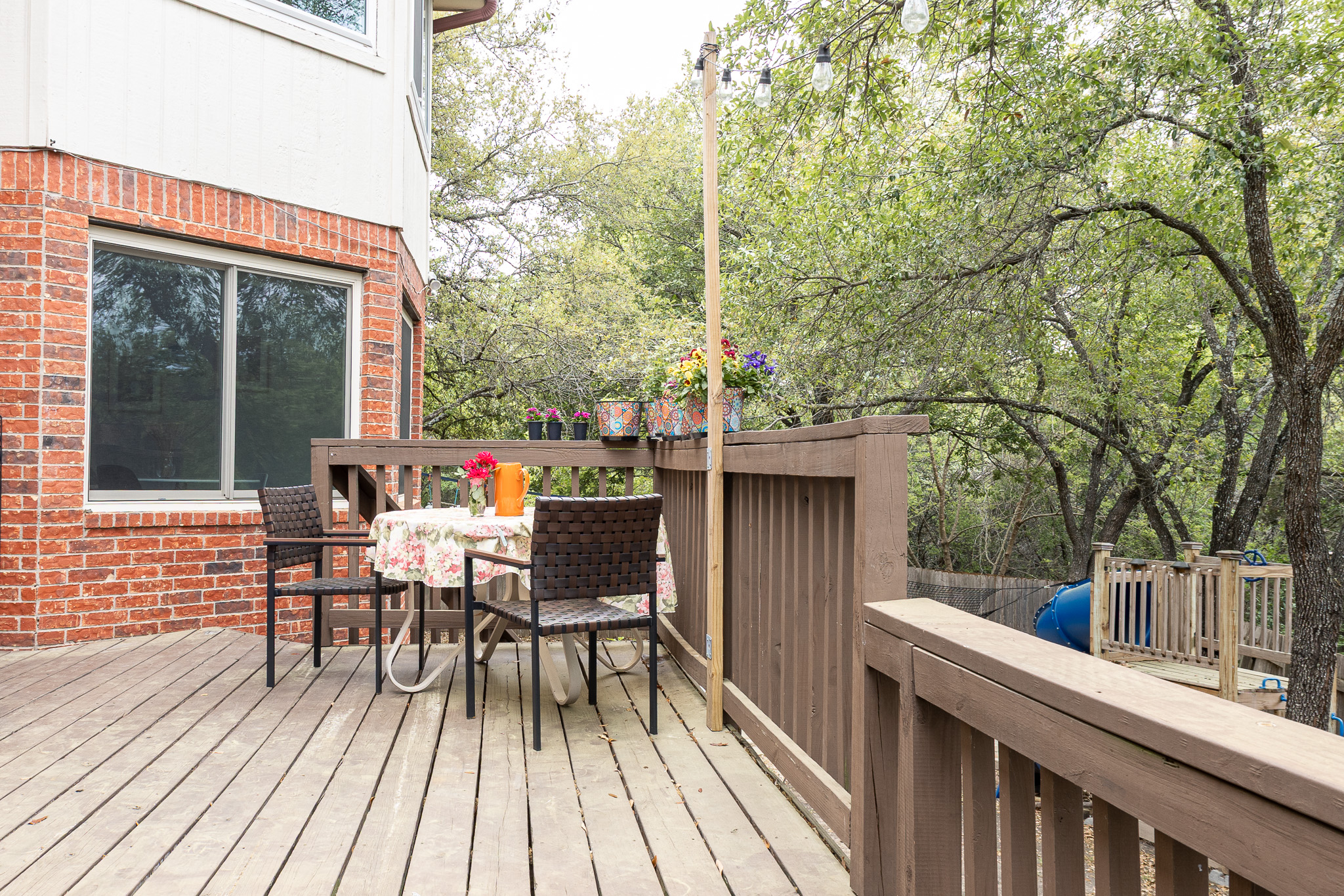 3704 Caney Creek Road Austin, TX 78732 - Photo 33 of 38 a view of a patio with a table and chairs
