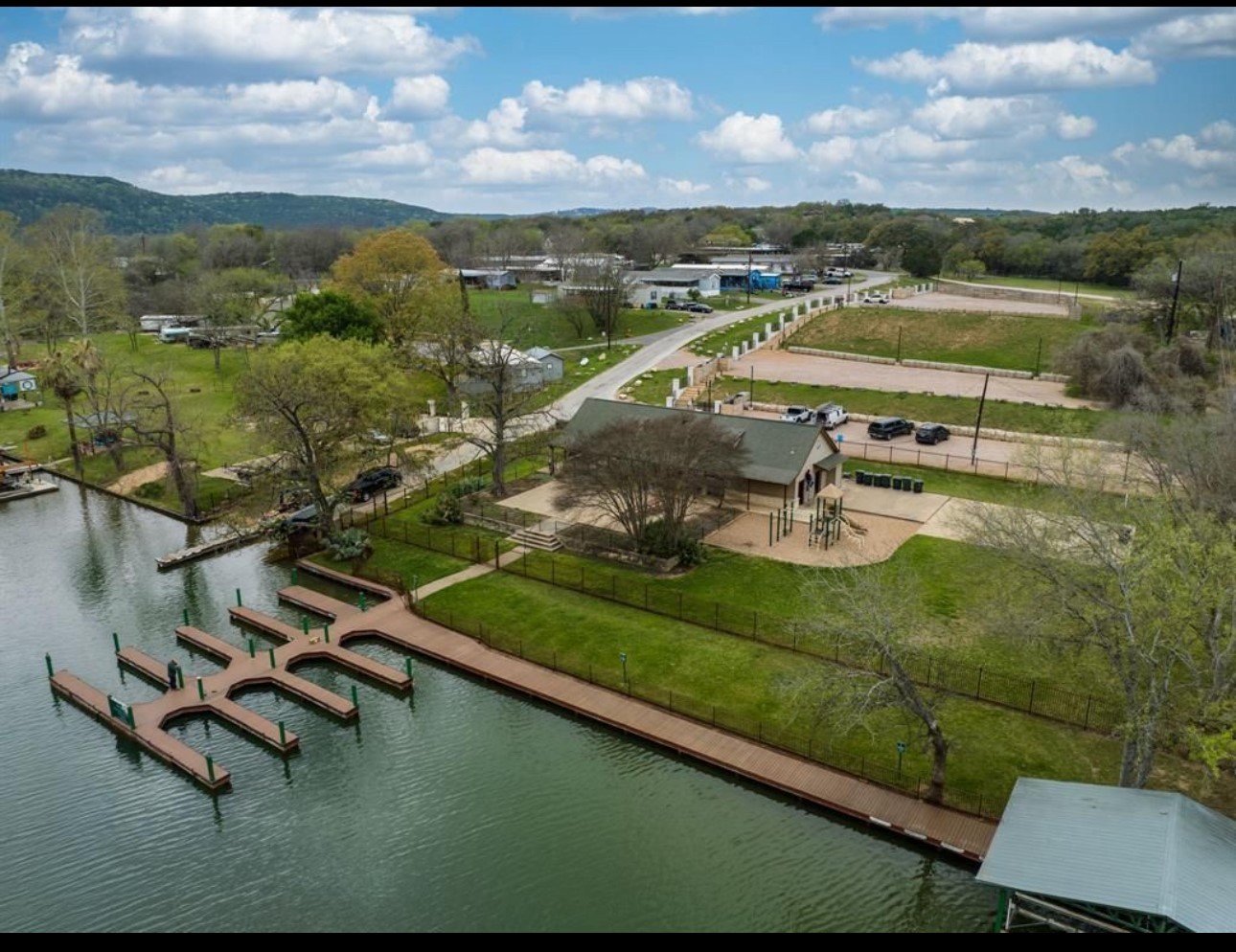 3704 Caney Creek Road Austin, TX 78732 - Photo 35 of 38 a view of a lake with a mountain