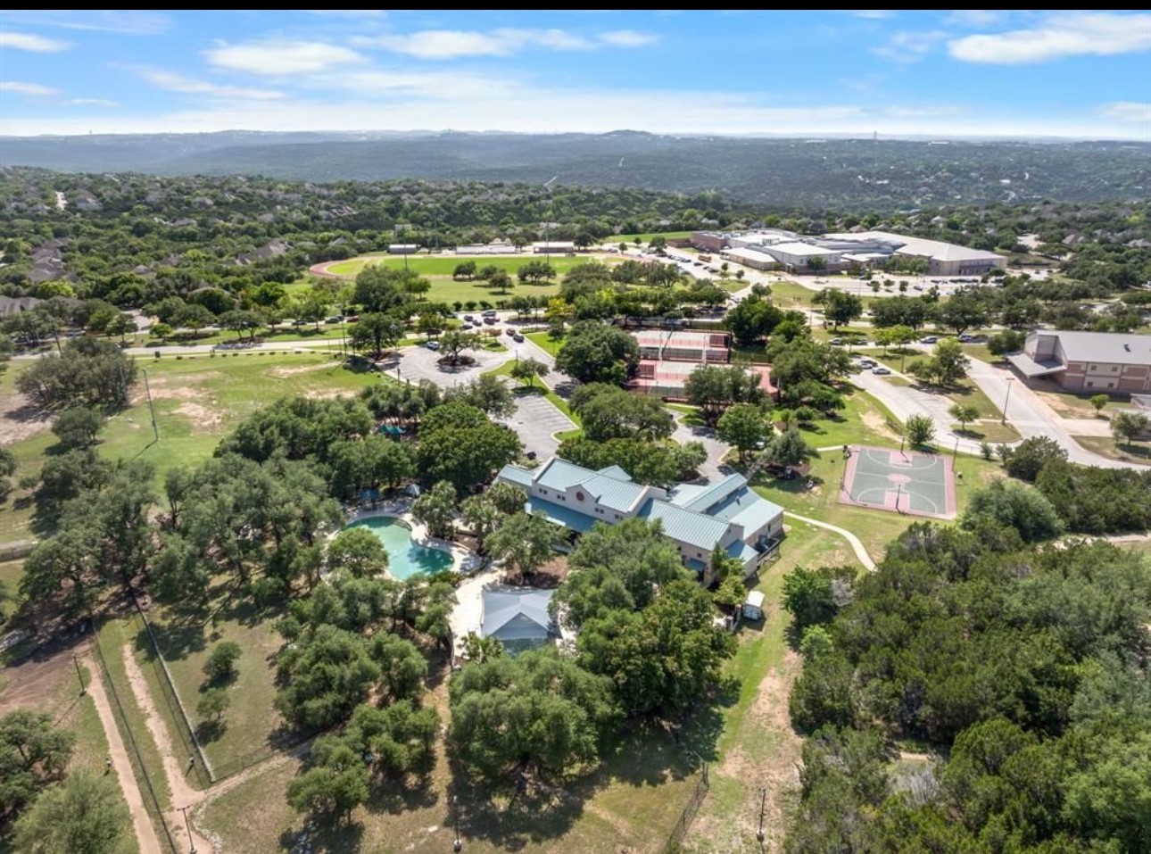 3704 Caney Creek Road Austin, TX 78732 - Photo 38 of 38 an aerial view of residential building with green space