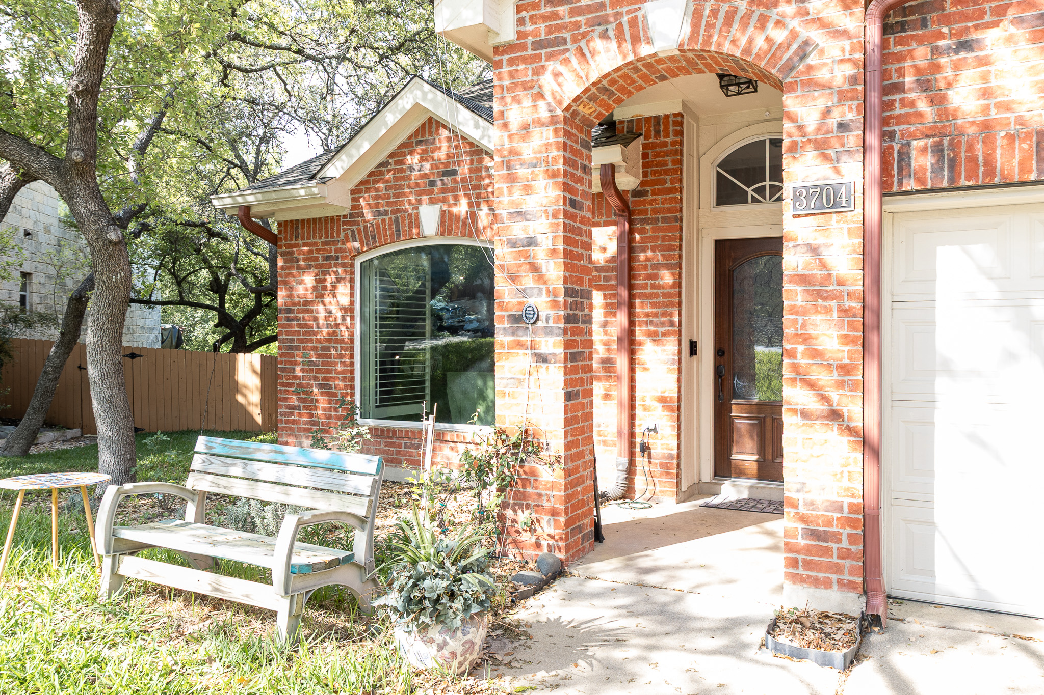 3704 Caney Creek Road Austin, TX 78732 - Photo 6 of 38 a front view of a house with a yard