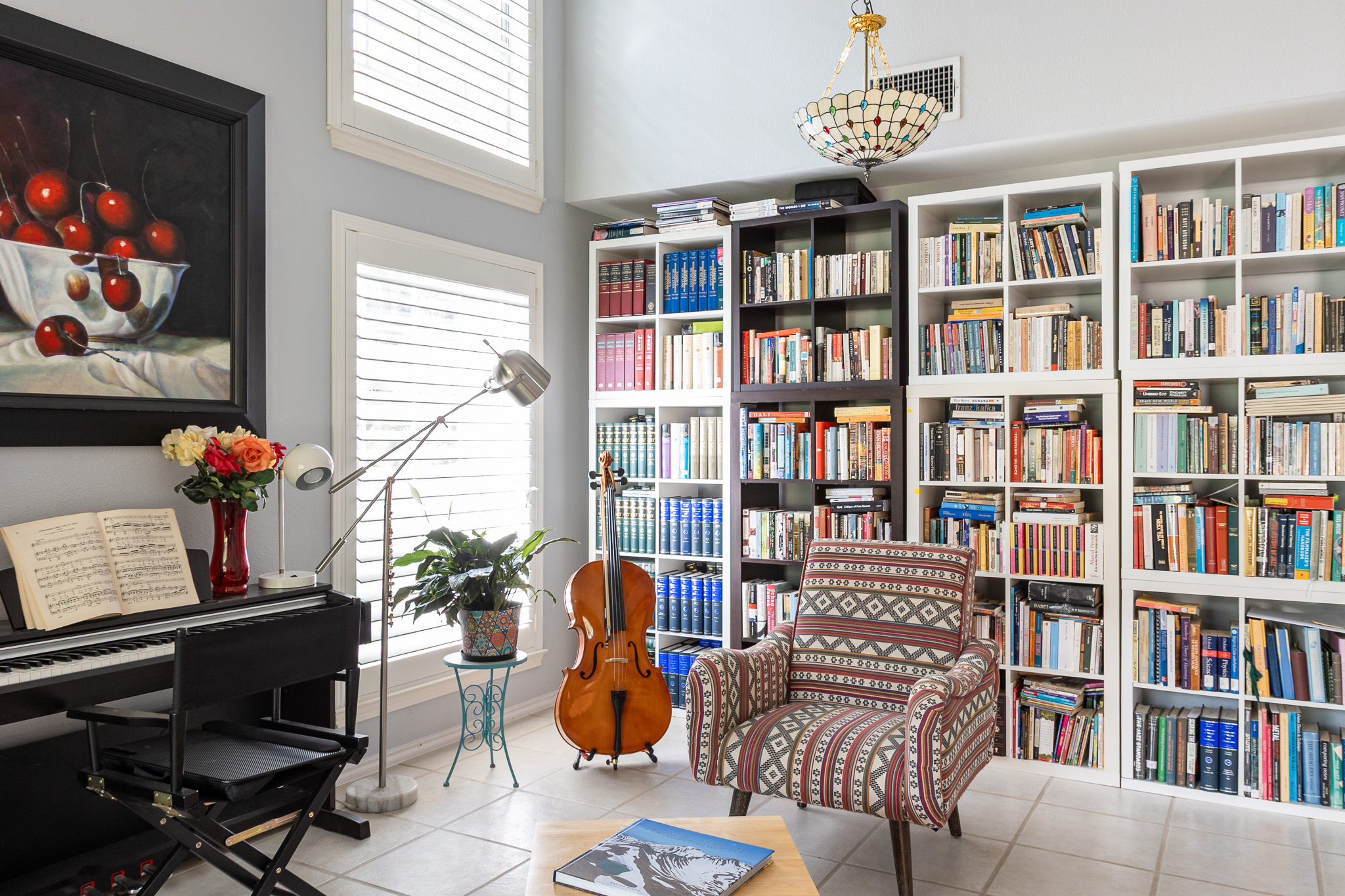 3704 Caney Creek Road Austin, TX 78732 - Photo 10 of 38 a living room with furniture and a book shelf