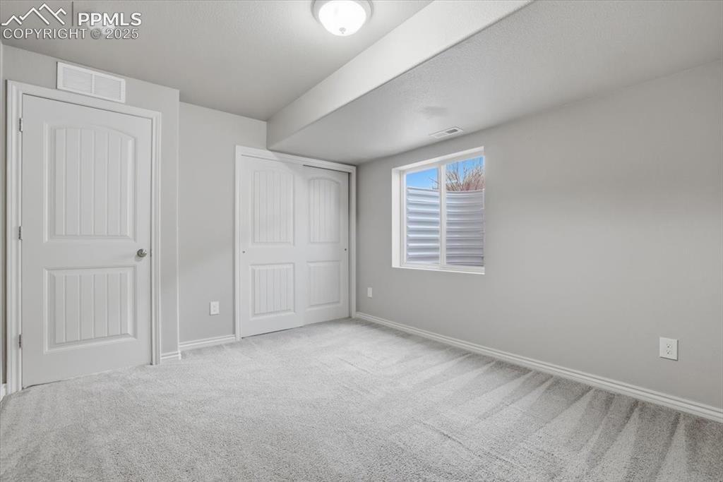 2374 Cinnabar Road Colorado Springs, CO 80921 - Photo 45 of 47 The basement-level bedroom is bright and spacious.