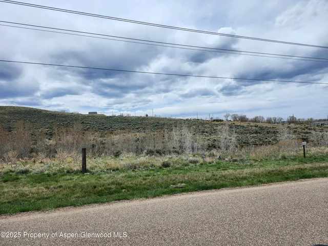 a view of a yard with an ocean view