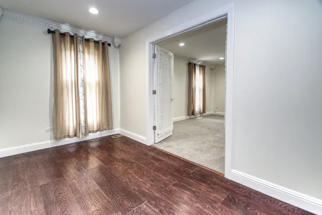 a kitchen with stainless steel appliances granite countertop a refrigerator a stove a sink and a microwave