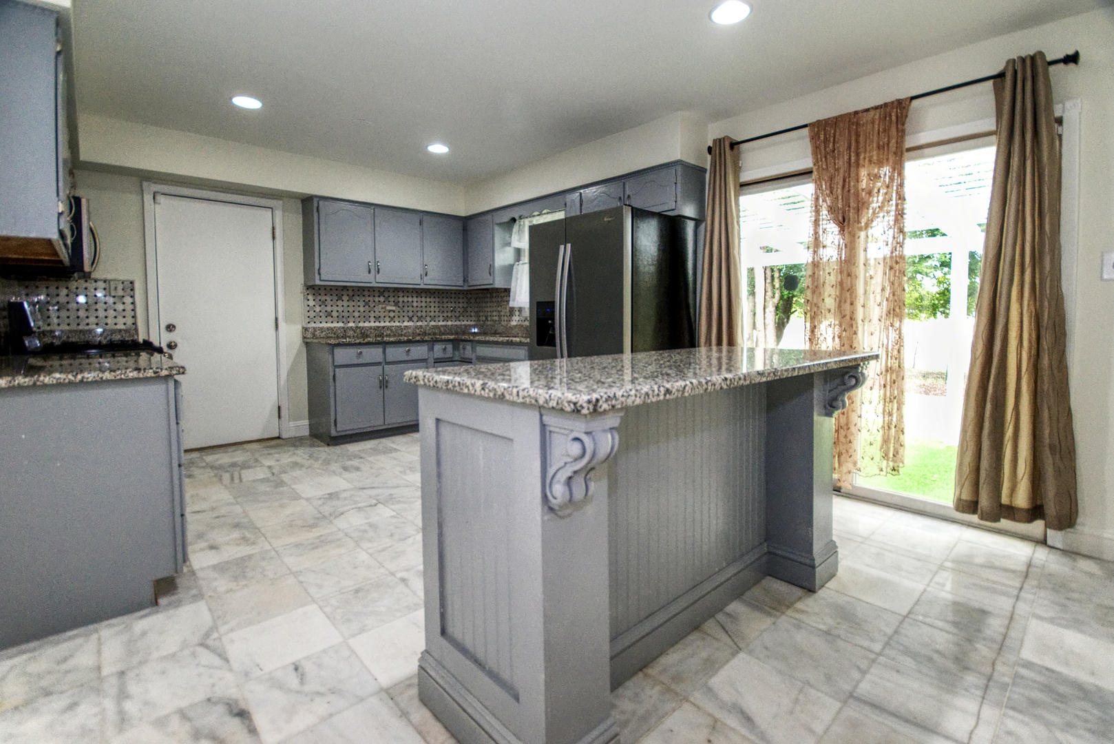 2312 Verdun Drive Joliet, IL 60435 - Photo 6 of 24 a kitchen with stainless steel appliances granite countertop a refrigerator a stove a sink and a microwave