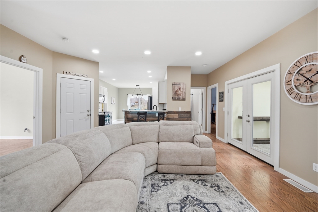 96 Stafford Hollow Road Monson, MA 01057 - Photo 11 of 39 a living room with furniture and a rug