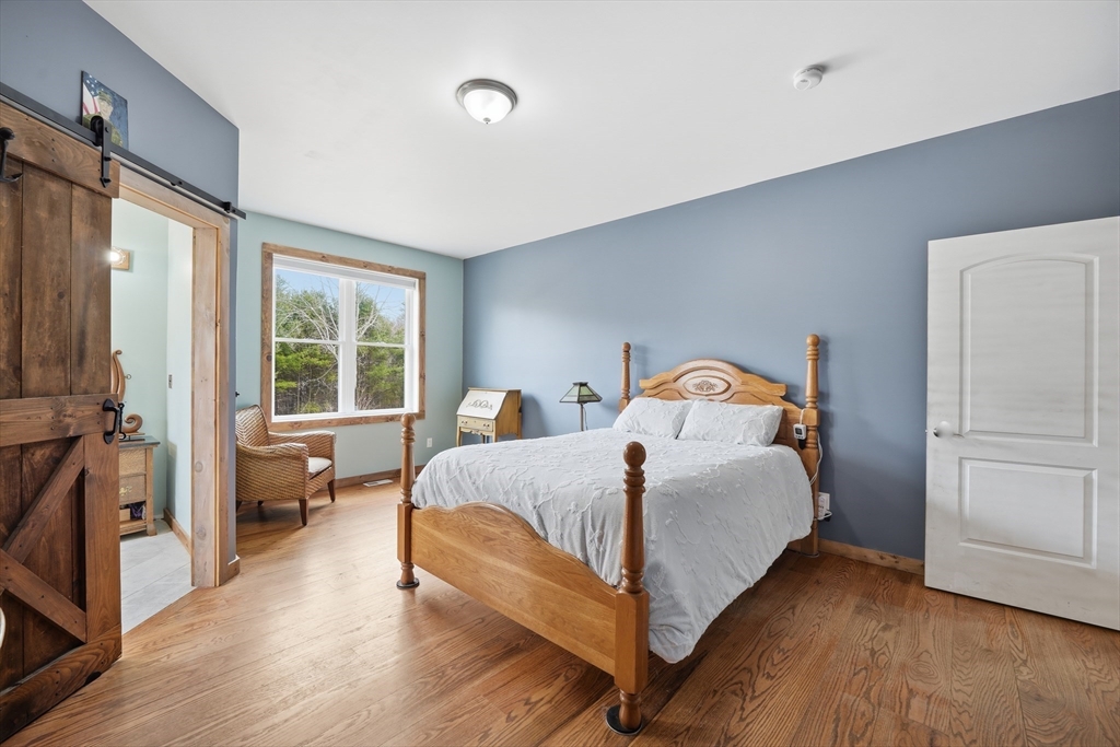 96 Stafford Hollow Road Monson, MA 01057 - Photo 17 of 39 a bed sitting in a bedroom next to a window