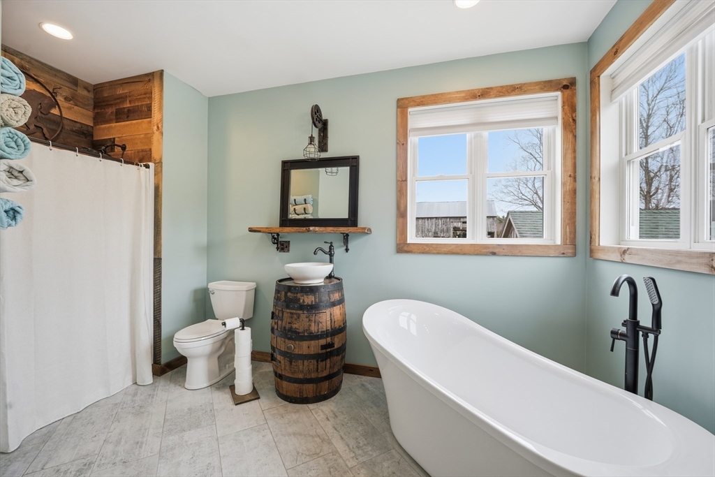 96 Stafford Hollow Road Monson, MA 01057 - Photo 21 of 39 a bathroom with a toilet sink and bathtub