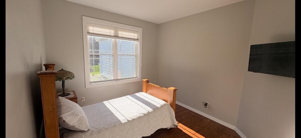 96 Stafford Hollow Road Monson, MA 01057 - Photo 22 of 39 a bed sitting in a bedroom next to a window