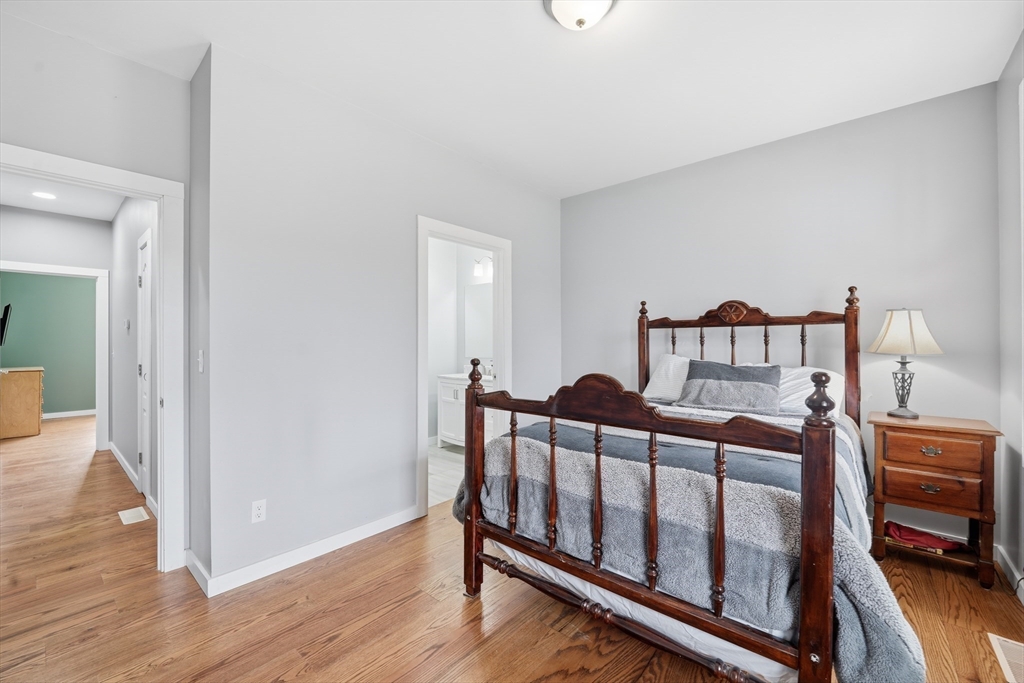 96 Stafford Hollow Road Monson, MA 01057 - Photo 23 of 39 a bedroom with furniture and wooden floor