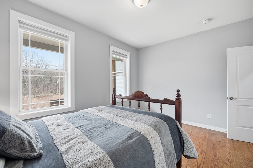 96 Stafford Hollow Road Monson, MA 01057 - Photo 25 of 39 a bedroom with a bed and a window