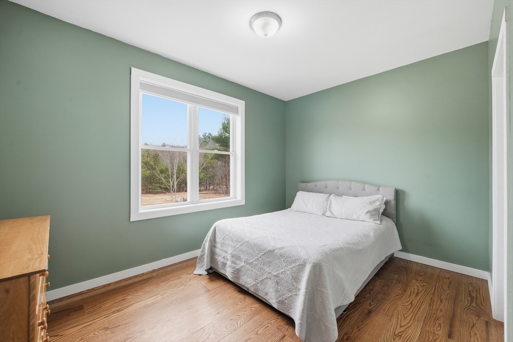 96 Stafford Hollow Road Monson, MA 01057 - Photo 28 of 39 a bedroom with a bed and a window