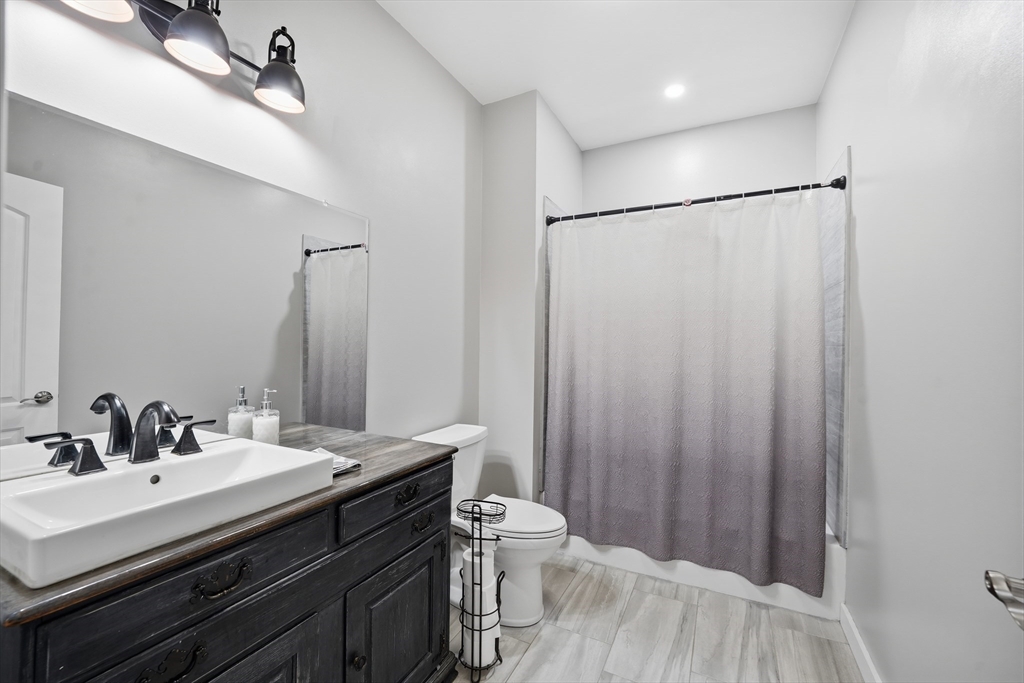 96 Stafford Hollow Road Monson, MA 01057 - Photo 31 of 39 a bathroom with a sink double vanity and a mirror