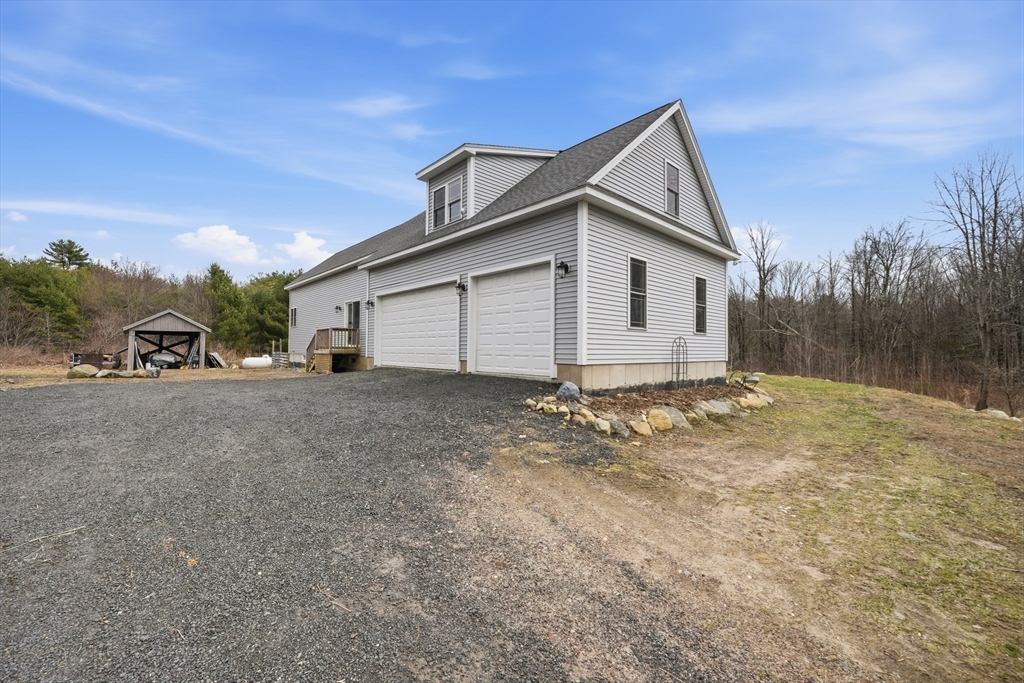 96 Stafford Hollow Road Monson, MA 01057 - Photo 35 of 39 a view of a house with a yard