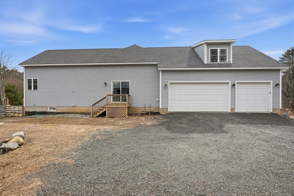 96 Stafford Hollow Road Monson, MA 01057 - Photo 36 of 39 a front view of a house with a yard and garage