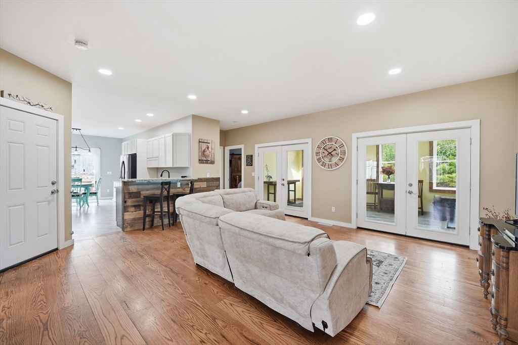 96 Stafford Hollow Road Monson, MA 01057 - Photo 9 of 39 a living room with furniture and a wooden floor