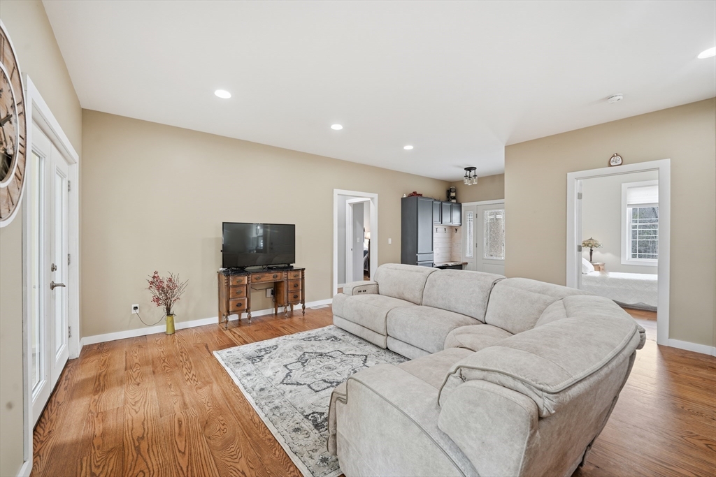 96 Stafford Hollow Road Monson, MA 01057 - Photo 10 of 39 a living room with furniture and a flat screen tv