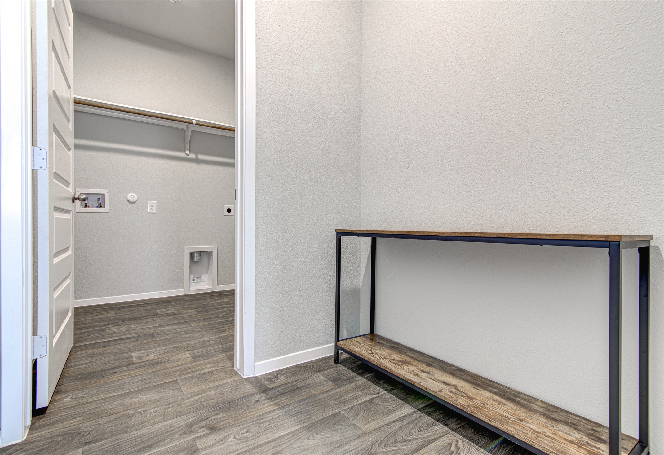 156 Tillage Road Elgin, TX 78621 - Photo 18 of 25 Functional laundry space with convenient hookups and durable flooring.