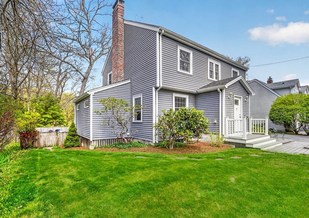 87 Payson Road Brookline, MA 02467 - Photo 41 of 41 a front view of a house with a garden