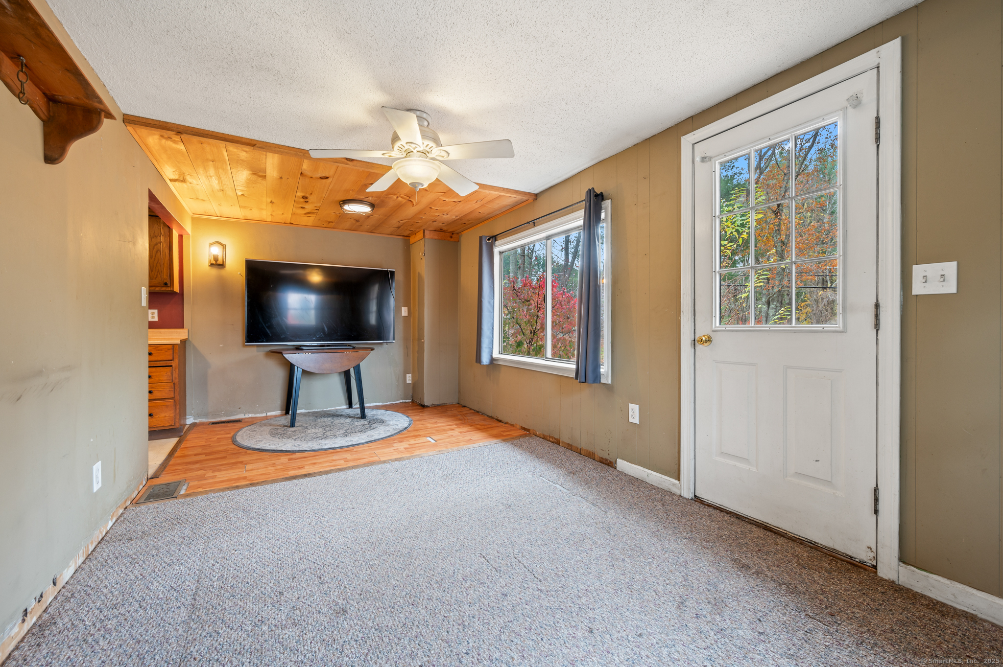 322 Crystal Lake Road Tolland, CT 06084 - Photo 13 of 29 a living room with furniture and a flat screen tv