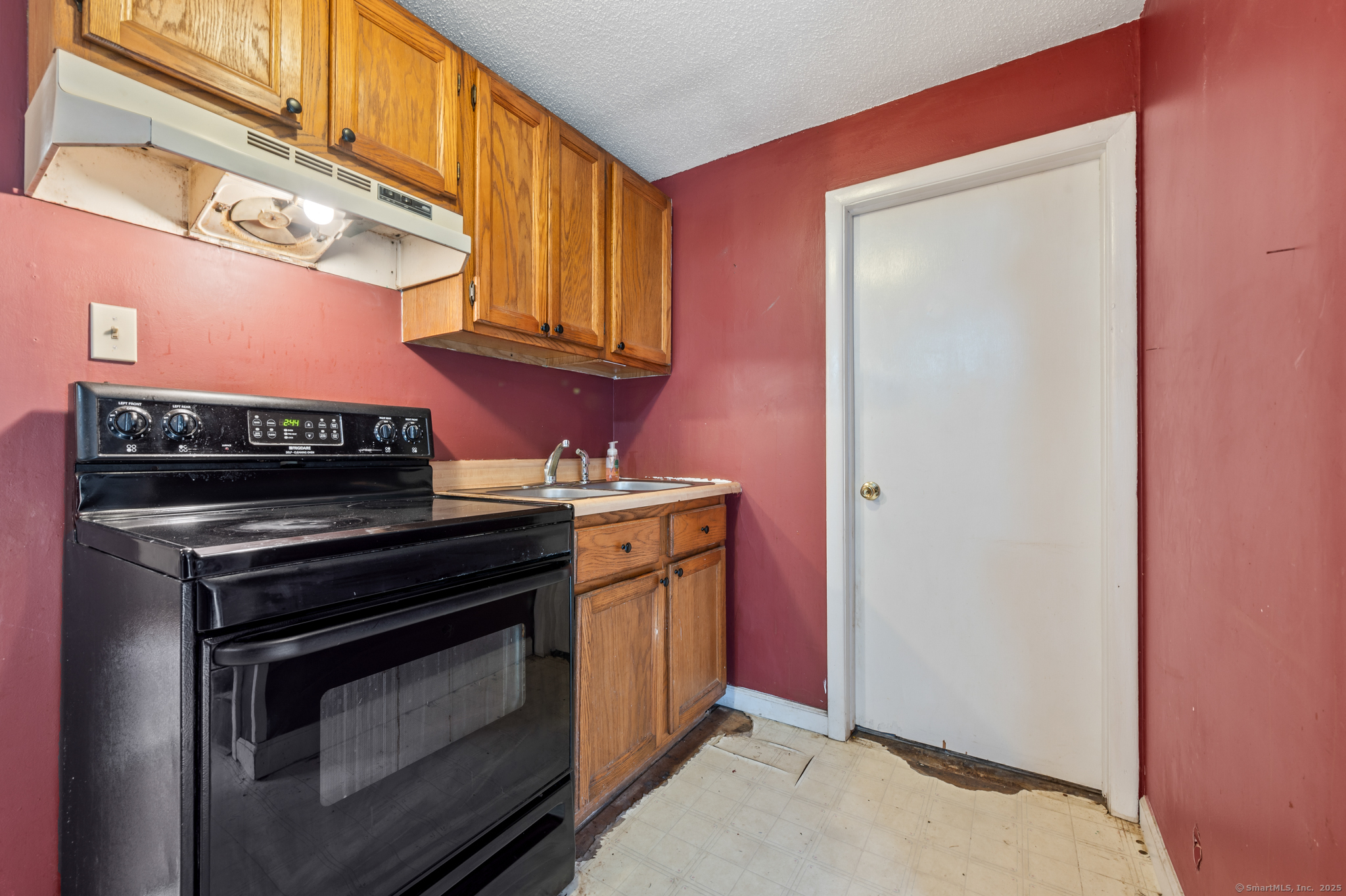 322 Crystal Lake Road Tolland, CT 06084 - Photo 26 of 29 a kitchen with a stove and a microwave