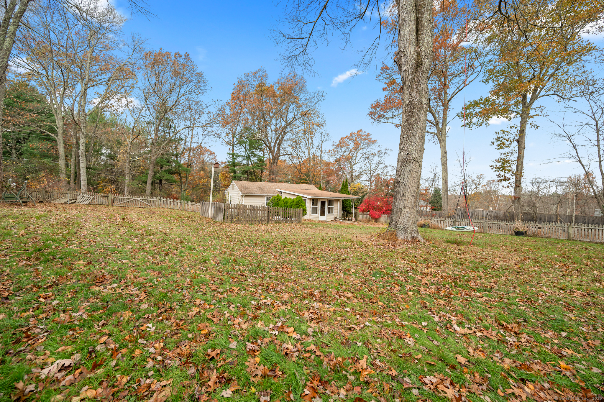 322 Crystal Lake Road Tolland, CT 06084 - Photo 5 of 29 a backyard of apartments with large trees