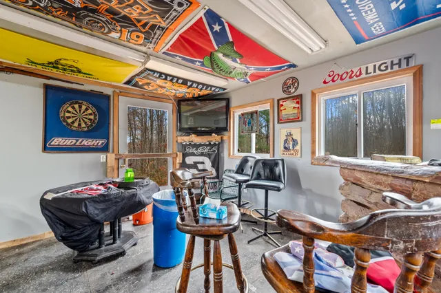 a dining room with furniture and window