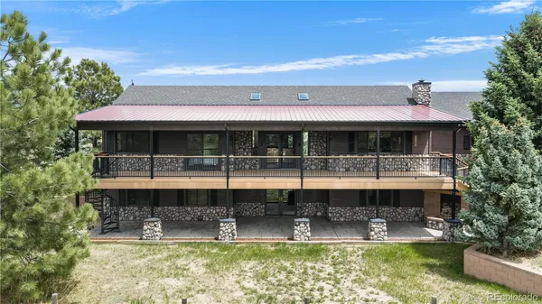 a front view of a house with swimming pool and porch