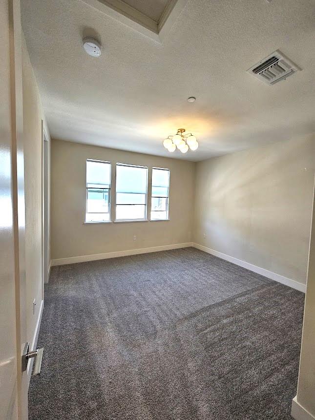 122 Ranch Lane Mountain View, CA 94040 - Photo 13 of 20 an empty room with windows and chandelier fan