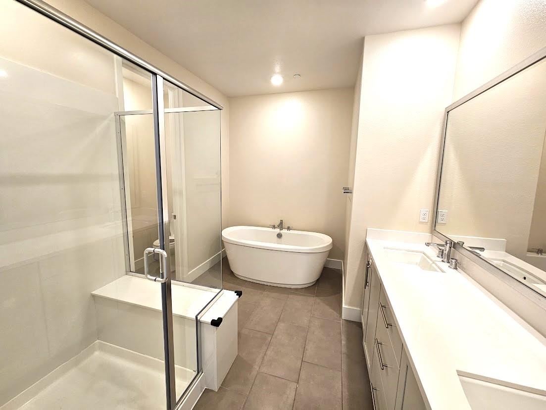 122 Ranch Lane Mountain View, CA 94040 - Photo 14 of 20 a bathroom with a double vanity sink a mirror and a bathtub