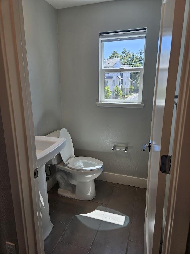 122 Ranch Lane Mountain View, CA 94040 - Photo 16 of 20 a white toilet sitting next to a bathroom sink